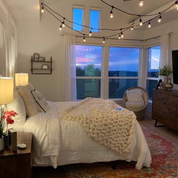 Lone Star Builders - a bedroom with a view of the ocean - General Contractors Near Me