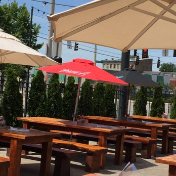 Queen City Radio - comfy tables with umbrellas for shade - Beer Gardens Near Me - Cincinnati, Ohio