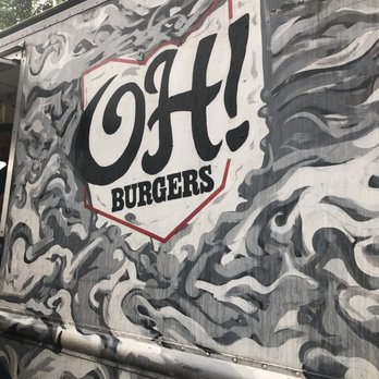 OH! Burgers - a man standing in front of a food truck - Burgers Near Me OH! Burgers - a man standing in front of a food truck - Burgers Near Me