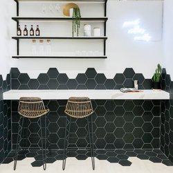 Bedrosians Tile & Stone - Countertop: Sequel Quartz: Macaubas, Backsplash: Costa Allegra Hex: Riverway, Floor: Barrique, Blanc 4" x 24