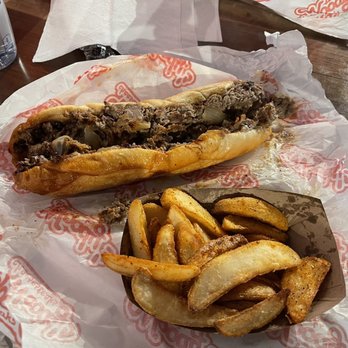 Woody's Cheesesteaks - Regular cheesesteak with -WOODY'S WEDGES- - New American Near Me - Atlanta, Georgia Woody's Cheesesteaks - Regular cheesesteak with -WOODY'S WEDGES- - New American Near Me - Atlanta, Georgia