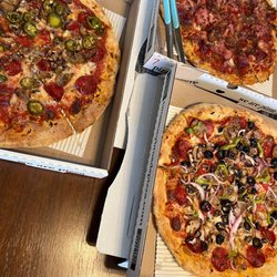 Omar's Pizzeria - Anytime I bring Omar's to a party, it's a hit. The Omar guys aren't too friendly though. See my review.