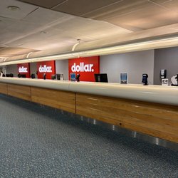 Dollar Car Rental - 1 agent on duty after several flights arrived