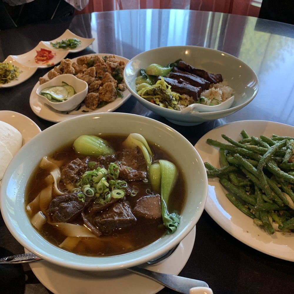 Facing East - clockwise: pork burger, Taiwanese chicken, pork over rice, fried string beans, beef noodle soup - Chinese Near Me - Bellevue, Washington Facing East - clockwise: pork burger, Taiwanese chicken, pork over rice, fried string beans, beef noodle soup - Chinese Near Me - Bellevue, Washington