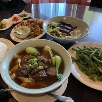 Facing East - clockwise: pork burger, Taiwanese chicken, pork over rice, fried string beans, beef noodle soup - Chinese Near Me - Bellevue, Washington Facing East - clockwise: pork burger, Taiwanese chicken, pork over rice, fried string beans, beef noodle soup - Chinese Near Me - Bellevue, Washington