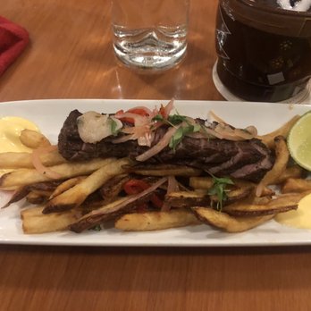Jock's Hangar Bar - Lomo Saltado Peruvian Flank Steak $14.00 - Cocktail Bars Near Me - Orlando, Florida