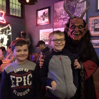 Frazier's On the Avenue - Great little stage area near front entrance. This is my kids meeting Krampus just before Xmas 2023. - American Near Me - Baltimore, Maryland Frazier's On the Avenue - Great little stage area near front entrance. This is my kids meeting Krampus just before Xmas 2023. - American Near Me - Baltimore, Maryland