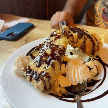 Chubby Trout - Two slice Deep fried cheesecake with vanilla ice cream and chocolate glaze and whip cream. - Seafood Near Me - Elkhart, Indiana Chubby Trout - Two slice Deep fried cheesecake with vanilla ice cream and chocolate glaze and whip cream. - Seafood Near Me - Elkhart, Indiana