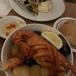 $38 Cioppino Bowl and $34 Tuna Nicoise in the back