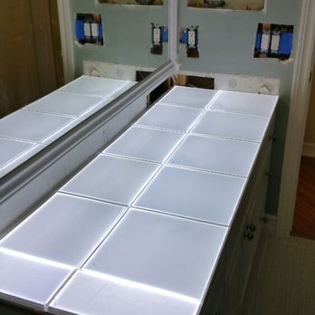 Trinity Electric - Bathroom counter with tile lights installed in countertop. - Electricians Near Me - Temecula, California Trinity Electric - Bathroom counter with tile lights installed in countertop. - Electricians Near Me - Temecula, California