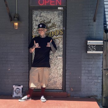 The Murder Art Collective - Justin in front of the shop door. - Tattoo Near Me - Lexington, Kentucky The Murder Art Collective - Justin in front of the shop door. - Tattoo Near Me - Lexington, Kentucky