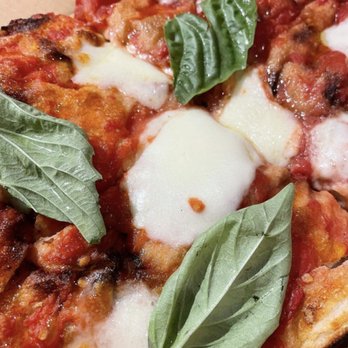 Qua Pizza - a slice of pizza with basil leaves - Pizza Near Me - Manasquan, New Jersey Qua Pizza - a slice of pizza with basil leaves - Pizza Near Me - Manasquan, New Jersey