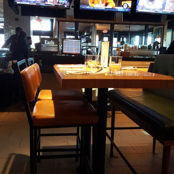 Earls Kitchen + Bar - Booth Action near Bar - Cocktail Bars Near Me - Plano, Texas