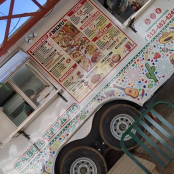 Sabor Tapatio - Food truck - A food truck featuring a Mexican-themed exterior with a menu board displaying tacos, burritos, and quesadillas. - Food Trucks Near Me - Austin, Texas