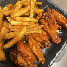 Wings and fries, half mango habanero half sweet and spicy Wings and fries, half mango habanero half sweet and spicy
