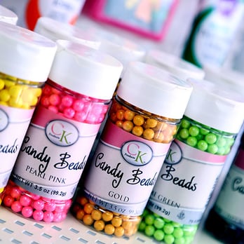 All Occasion Cake Supply - a row of candy covered jars - Cupcakes Near Me - Houston, Texas All Occasion Cake Supply - a row of candy covered jars - Cupcakes Near Me - Houston, Texas