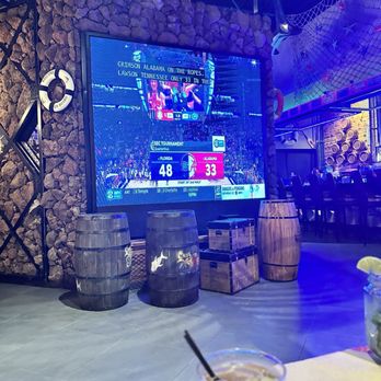 Seafood Dock - Gator game on big screen & Jim beam whiskey cocktail with ginger flavor. - Seafood Near Me - Gainesville, Florida