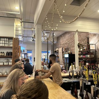 Savannah Bee Company - customers at the bar - Cosmetics & Beauty Supply Near Me - Charleston, South Carolina