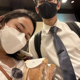  a man and a woman wearing face masks