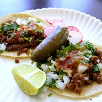 Los Compadres Taco Truck - two tacos on a paper plate - Mexican Near Me