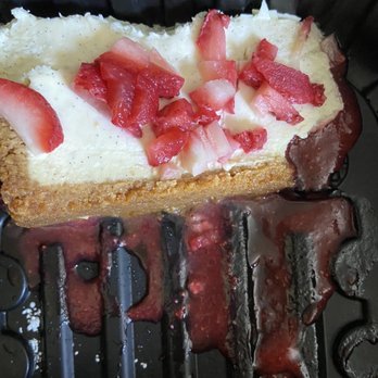 The District Tap - $10 piece of cheesecake that was less than 2 in thick  Vanilla Bean Cheesecake - Sports Bars Near Me - Indianapolis, Indiana