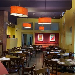 a restaurant with tables and chairs