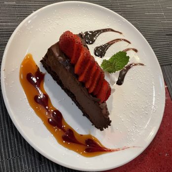 Benny John's Bar and Grill - Chocolate mousse cake with homemade caramel and raspberry sauce - Steakhouses Near Me - New York, New York