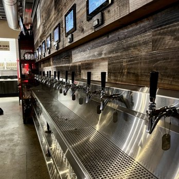 The Redd Dog - The pulls with pint glasses below & interactive screens that showcase the drink on tap. Beer, wine, ciders, and kombucha available. - Bars Near Me - Tacoma, Washington