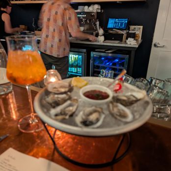 Tangerine Bistro - Half dozen oysters and spritz. - French Near Me - Truckee, California Tangerine Bistro - Half dozen oysters and spritz. - French Near Me - Truckee, California