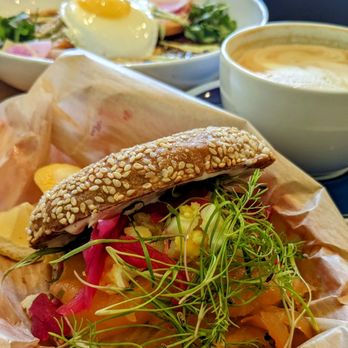 Songbird - Lox on a Sesame Seed Bialy: cured salmon, cream cheese, capers, micro greens, pickled red onions, and an egg. - Breakfast & Brunch Near Me - St. Louis, Missouri Songbird - Lox on a Sesame Seed Bialy: cured salmon, cream cheese, capers, micro greens, pickled red onions, and an egg. - Breakfast & Brunch Near Me - St. Louis, Missouri