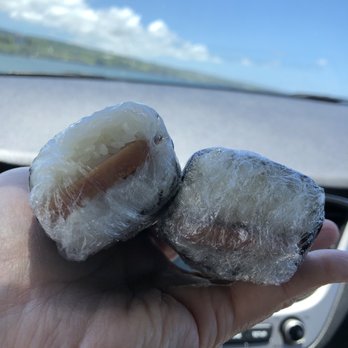 Poke To Your Taste - a hand holding two frozen donuts - Poke Near Me - Hilo, Hawaii