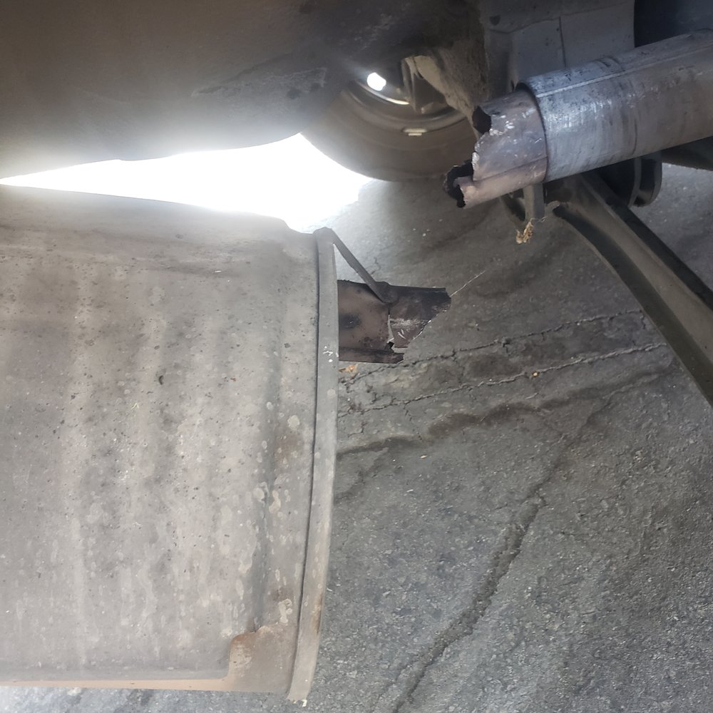 broken rusted pipe on the muffler broken rusted pipe on the muffler