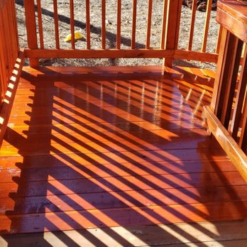 Batts Construction - a wooden deck with railings - General Contractors Near Me