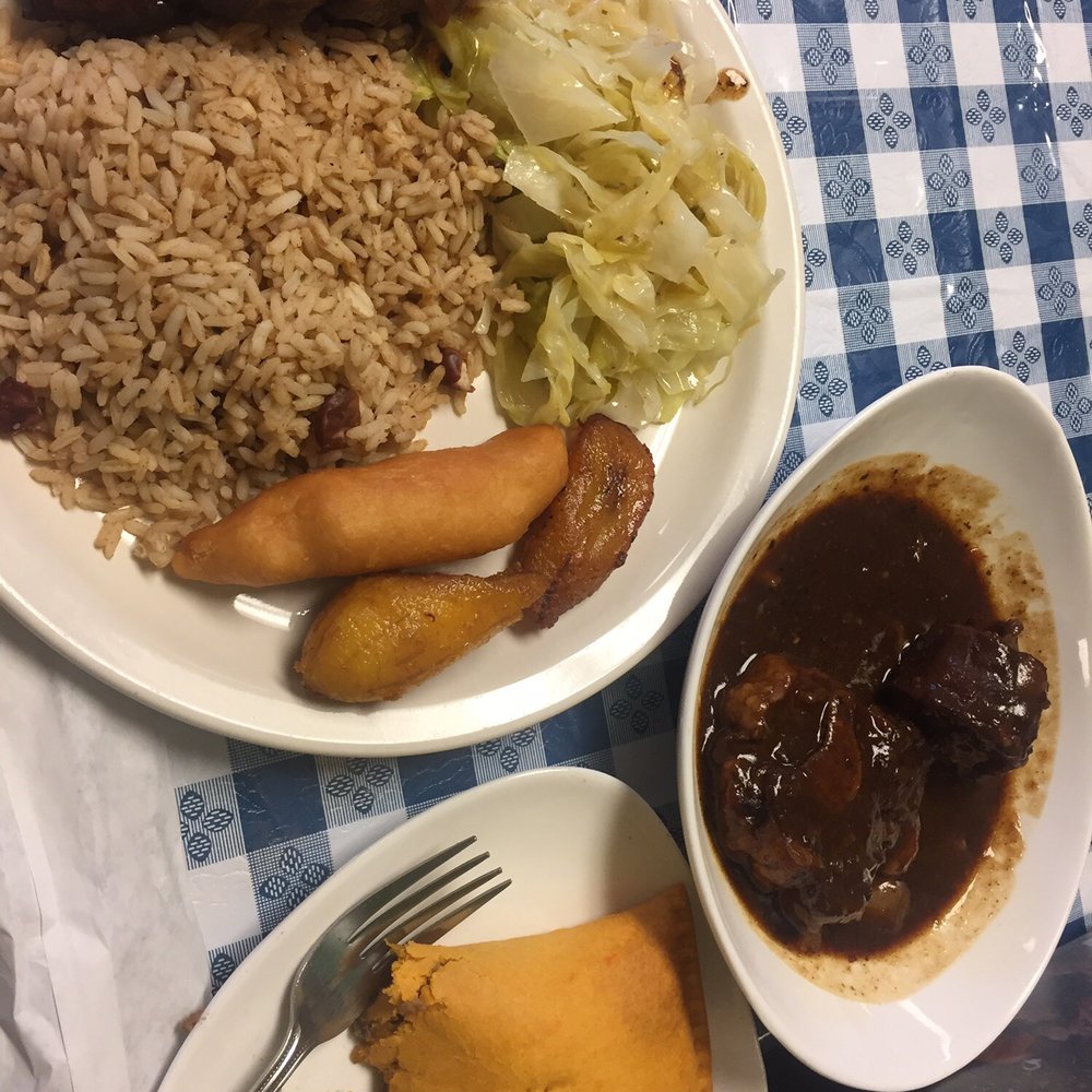 Oxtails, jerk pork, rice and beans, festival, plantains, beef patty Oxtails, jerk pork, rice and beans, festival, plantains, beef patty