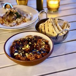 Hayat - Muhammara - roasted pepper purée topped with walnut, pistachio, and pomegranate molasses, served with bread