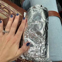 Alaina'S Guac N' Roll - This is the biggest burrito I have ever seen. Hand for scale