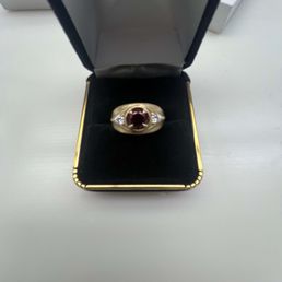 Ring made from the gold in my late wife's engagement rings, wedding band and my wedding band. Ring made from the gold in my late wife's engagement rings, wedding band and my wedding band.