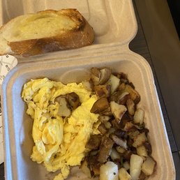 2 eggs with potatoes and baguette