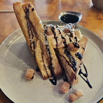 Toast Kitchen & Bakery - Churro French Toast - meh. It's literally toast. Not egg wash dipped. Not crispy. Guava puree and strange tropical flavored whipped cream. - Breakfast & Brunch Near Me - Costa Mesa, California Toast Kitchen & Bakery - Churro French Toast - meh. It's literally toast. Not egg wash dipped. Not crispy. Guava puree and strange tropical flavored whipped cream. - Breakfast & Brunch Near Me - Costa Mesa, California