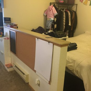 North Hill Apartments - Room, queen bed w/ storage + wire closet, still space around the bed (studio/2nd building). - Apartments Near Me - Tukwila, Washington North Hill Apartments - Room, queen bed w/ storage + wire closet, still space around the bed (studio/2nd building). - Apartments Near Me - Tukwila, Washington