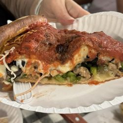 Piccolo's Italian Restaurant - Deep dish pizza with sausage, mushrooms, olives, spinach, tomatoes and peppers