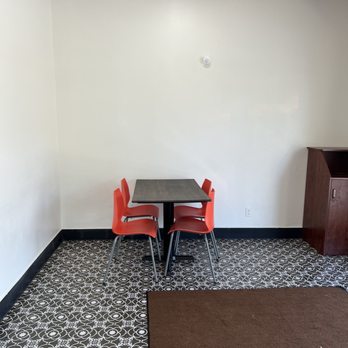 Kams Pizza - a table and chairs in a small room - Pizza Near Me - Fresno, California Kams Pizza - a table and chairs in a small room - Pizza Near Me - Fresno, California