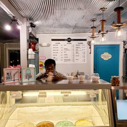 a man behind a counter a man behind a counter