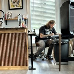 Ink Therapy Tattoo & Piercing - Putting the finishing touches! Dave's the man!