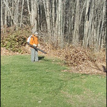Maine Lawn Pros - a man holding a baseball bat - Snow Removal Near Me Maine Lawn Pros - a man holding a baseball bat - Snow Removal Near Me