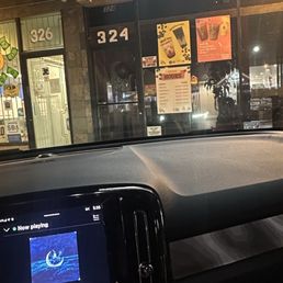 Clock on car showing the time and the place dark