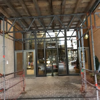 2Hopkins - Entrance of 2 Hopkins Apartments in Downtown Baltimore. Scaffolding at only entrance after 6 PM - Apartments Near Me - Baltimore, Maryland