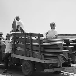 Bob Haakenson Fiberglass - me at 17 sitting atop bunch of state of the art Surfboards Hawaii boards moving to new location 1962