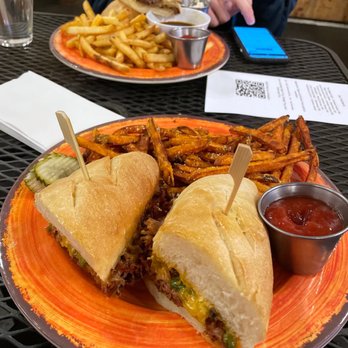 SAAL Brewing - Foreground: Spicy Smoked Pork Hero, with sweet potato fries. Background: SAAL Dip, with fries. - Brewpubs Near Me - Stanwood, Washington SAAL Brewing - Foreground: Spicy Smoked Pork Hero, with sweet potato fries. Background: SAAL Dip, with fries. - Brewpubs Near Me - Stanwood, Washington