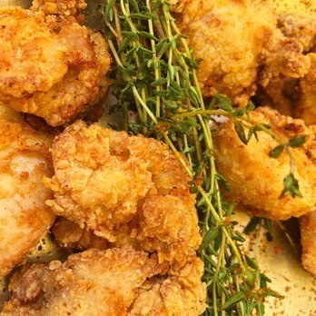 Rooster Boy - a pile of fried chicken with a sprig of thyme - Chicken Shop Near Me - Brooklyn, New York